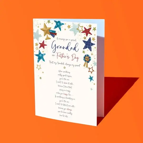A Father’s Day card for a grandad with colourful star decorations and a heartfelt message printed on the front, displayed against a bright orange background.